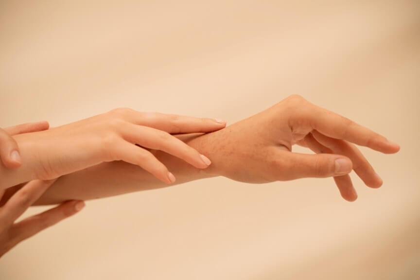 Hand rejuvenation treatment addressing aging, wrinkles, and volume loss at a Toronto medical clinic.